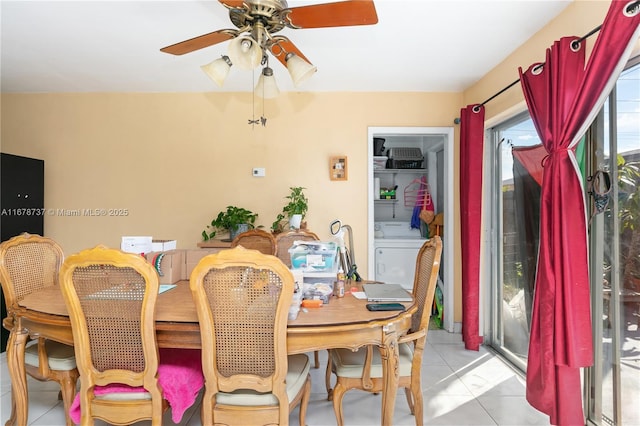 tiled dining area featuring ceiling fan and washer / clothes dryer