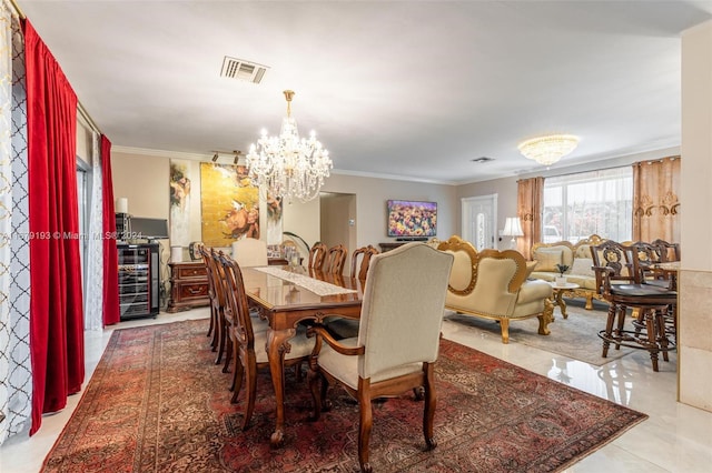 tiled dining space featuring a notable chandelier and ornamental molding