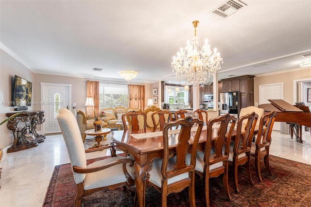 dining area featuring an inviting chandelier and crown molding