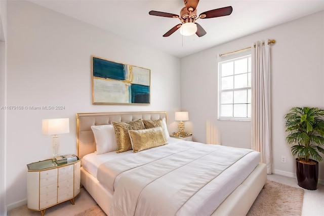 bedroom with light carpet and ceiling fan