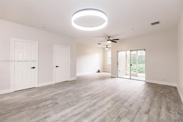 empty room featuring light hardwood / wood-style floors and ceiling fan