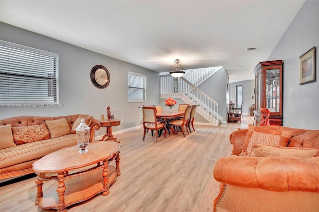 living room with light hardwood / wood-style floors