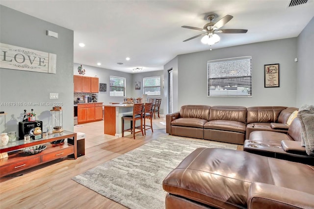 3544 W 94th St, Hialeah, FL 33018 - living area featuring light wood-style flooring, ceiling fan, and recessed lighting