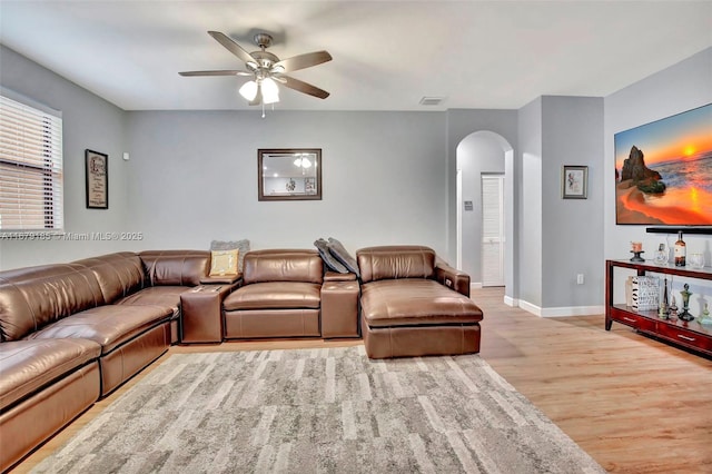3544 W 94th St, Hialeah, FL 33018 - living room with arched walkways, wood finished floors, and a ceiling fan