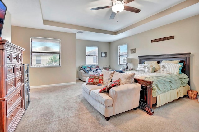 3544 W 94th St, Hialeah, FL 33018 - bedroom with light carpet, a tray ceiling, and ceiling fan