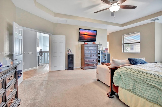 3544 W 94th St, Hialeah, FL 33018 - bedroom with light carpet, a raised ceiling, and a ceiling fan