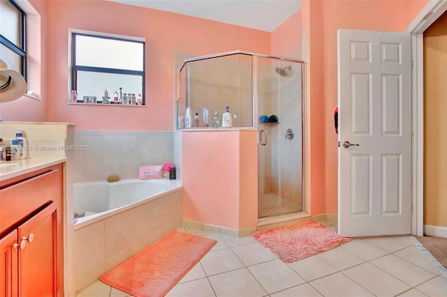 3544 W 94th St, Hialeah, FL 33018 - bathroom featuring vanity, a stall shower, a bath, and tile patterned flooring