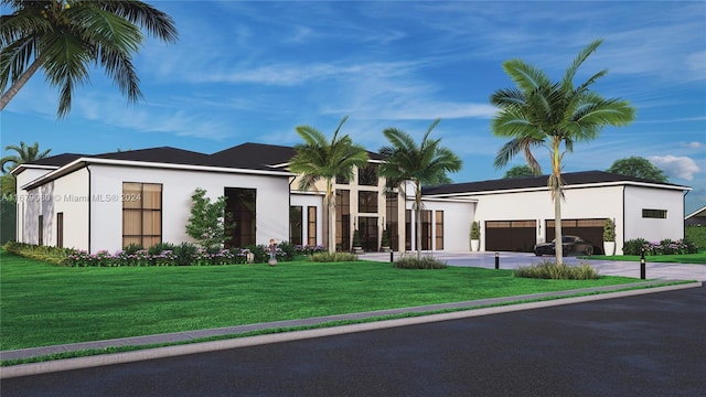 view of front facade with a front yard and a garage