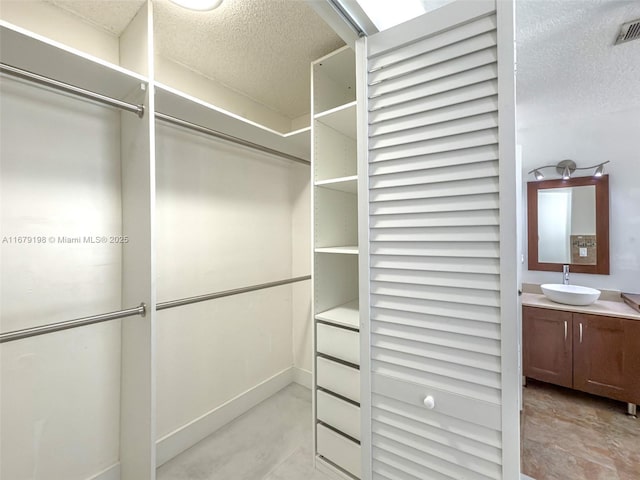 walk in closet with sink