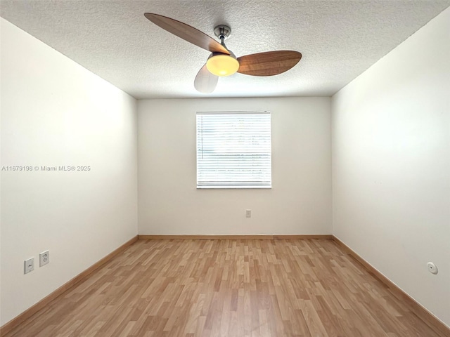 empty room featuring a textured ceiling, ceiling fan, and light hardwood / wood-style floors