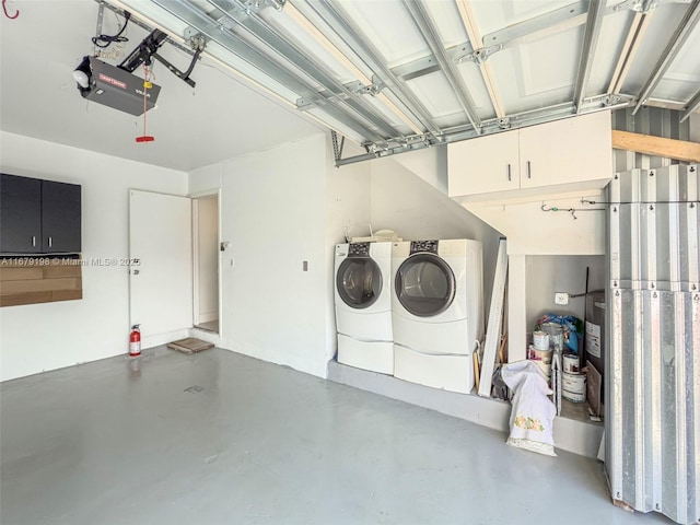 garage with a garage door opener and washer and clothes dryer