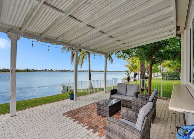 view of patio / terrace featuring outdoor lounge area and a water view