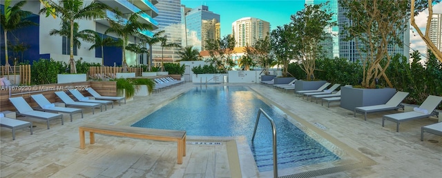 view of swimming pool featuring a patio area