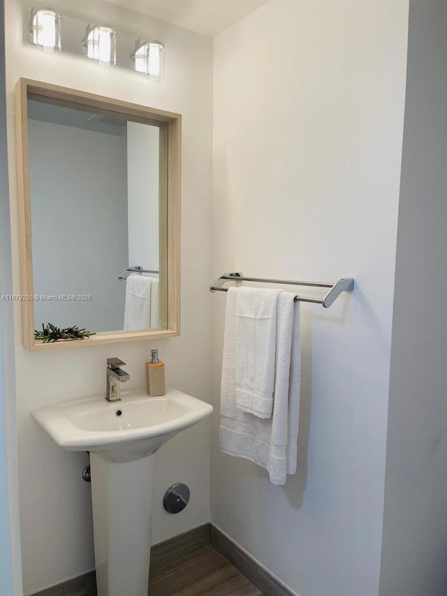 bathroom with wood-type flooring