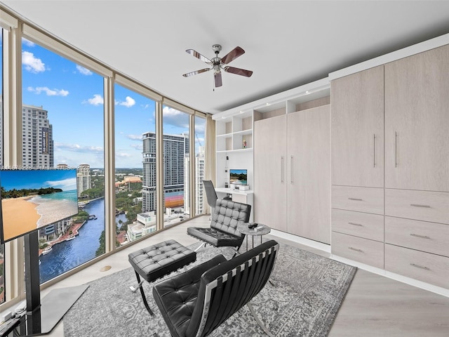 interior space featuring hardwood / wood-style flooring, expansive windows, and plenty of natural light