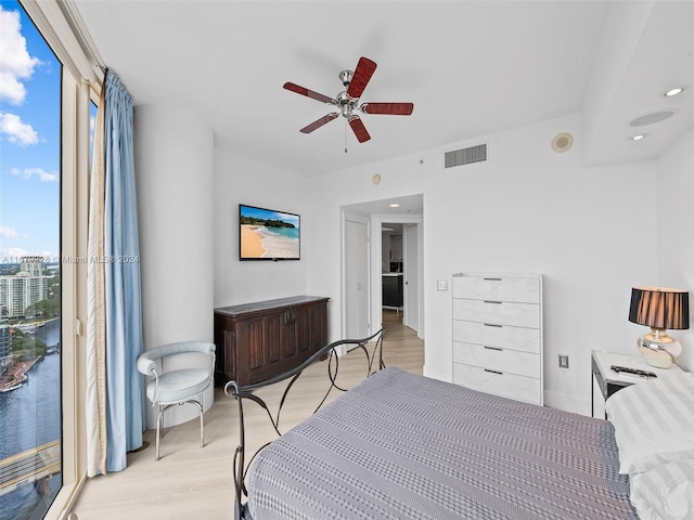 bedroom featuring ceiling fan and light hardwood / wood-style floors