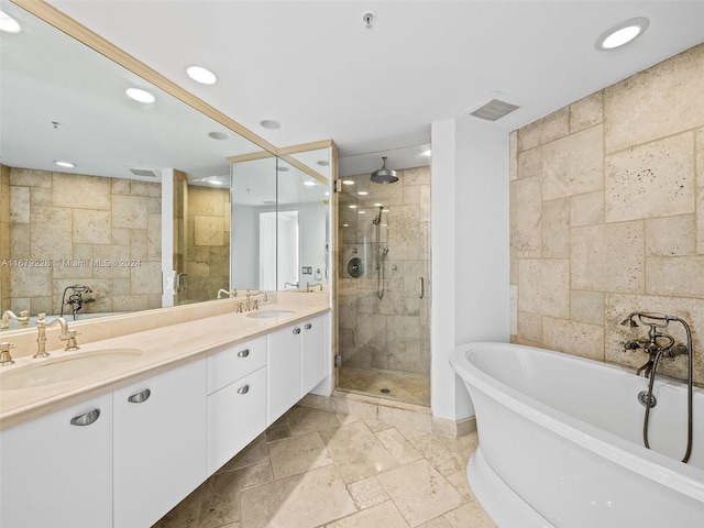 bathroom featuring vanity and separate shower and tub