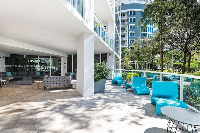 view of patio with a balcony and outdoor lounge area