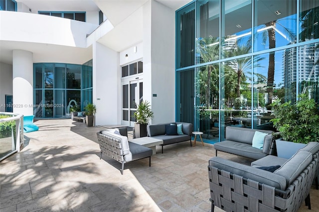 view of patio / terrace with french doors and an outdoor living space