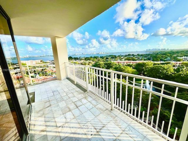 balcony featuring a water view