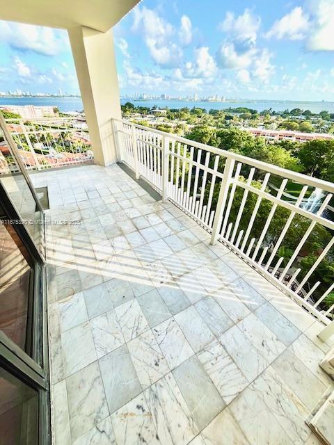 balcony featuring a water view