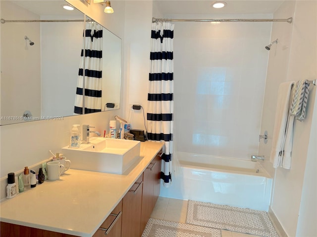 bathroom featuring vanity, tile patterned floors, and shower / bath combo with shower curtain