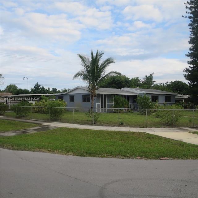 ranch-style home with a front yard