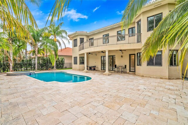 view of swimming pool featuring a patio area and ceiling fan