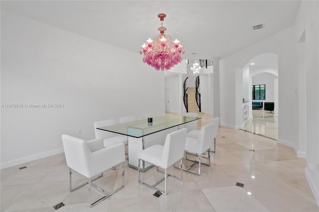 dining space with a chandelier