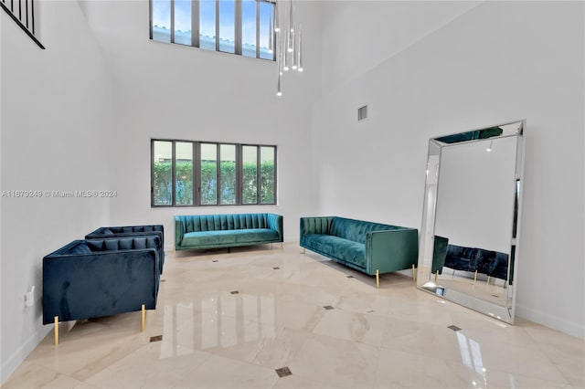 living room with a towering ceiling