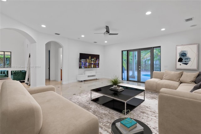 living room with french doors and ceiling fan