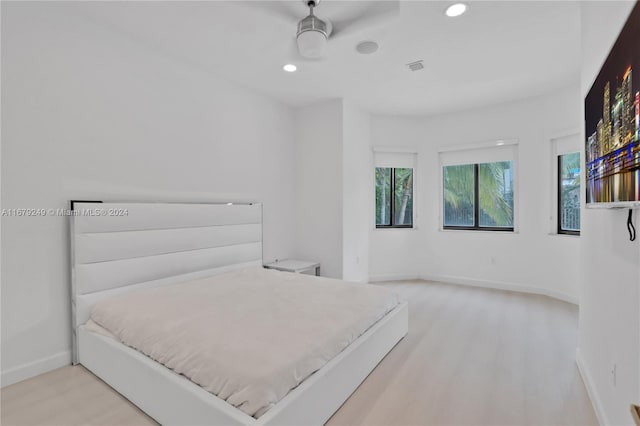 bedroom featuring light wood-type flooring and ceiling fan