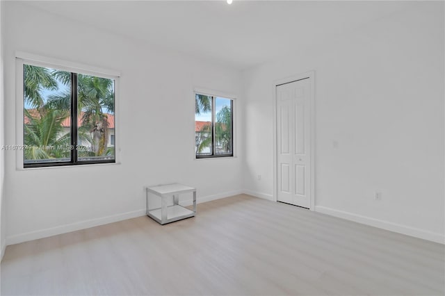 empty room with light wood-type flooring