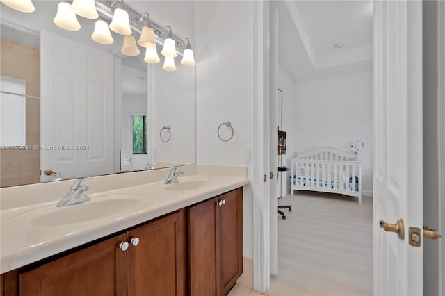 bathroom with vanity and wood-type flooring