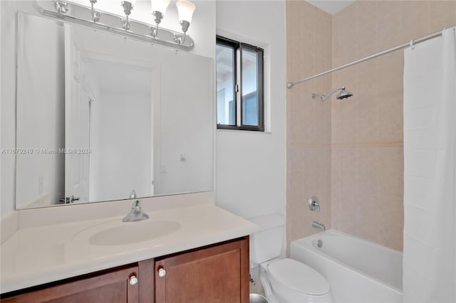 full bathroom featuring vanity, toilet, and shower / bathtub combination with curtain