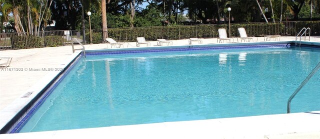 112 Lake Emerald Dr Unit 109, Oakland Park, FL 33309 - view of pool featuring a patio