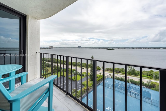 balcony featuring a water view