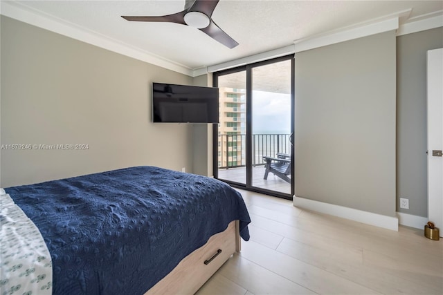 bedroom with access to outside, ornamental molding, expansive windows, light hardwood / wood-style floors, and ceiling fan