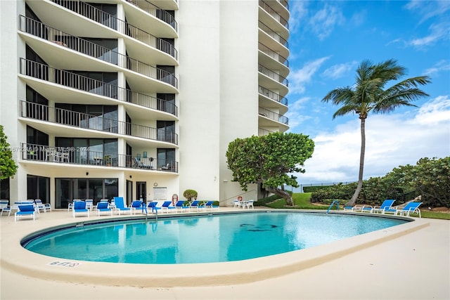 view of swimming pool featuring a patio area