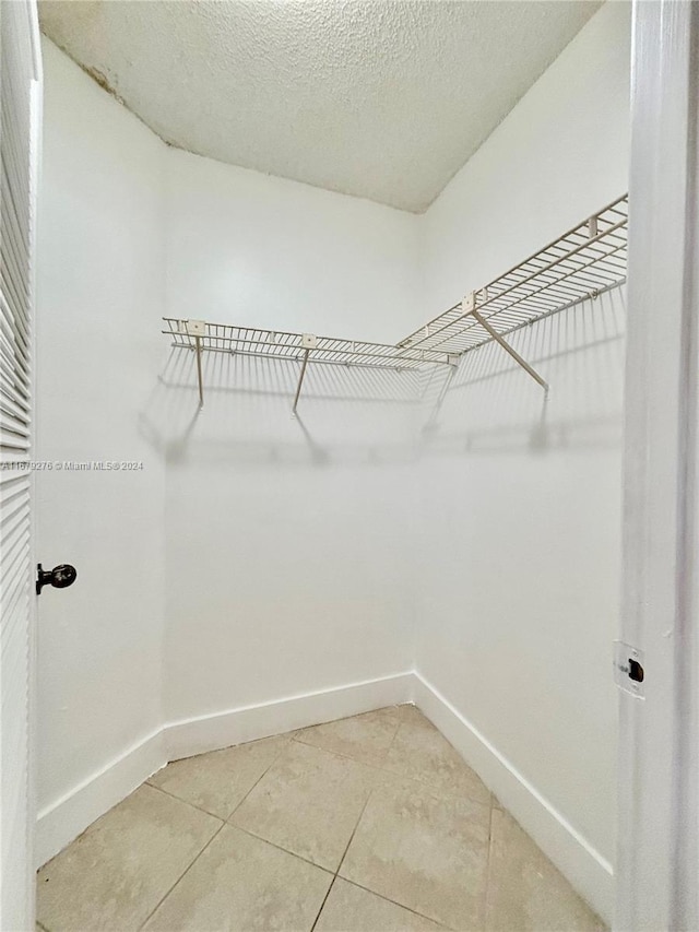 3405 NW 44th St Unit 104, Oakland Park, FL 33309 - spacious closet featuring light tile patterned flooring