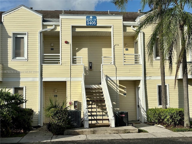 3405 NW 44th St Unit 104, Oakland Park, FL 33309 - view of building exterior featuring stairs and central air condition unit