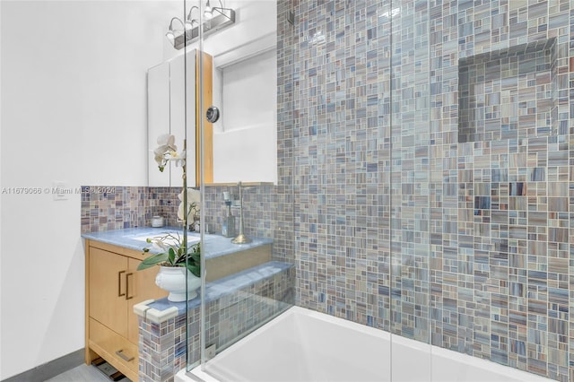 bathroom with vanity and backsplash