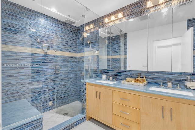 bathroom featuring a shower with door, tasteful backsplash, tile walls, and vanity