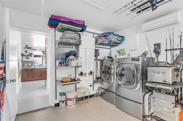 clothes washing area featuring an AC wall unit, independent washer and dryer, and ceiling fan