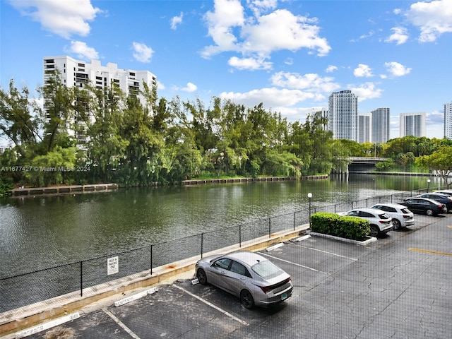 view of parking featuring a water view