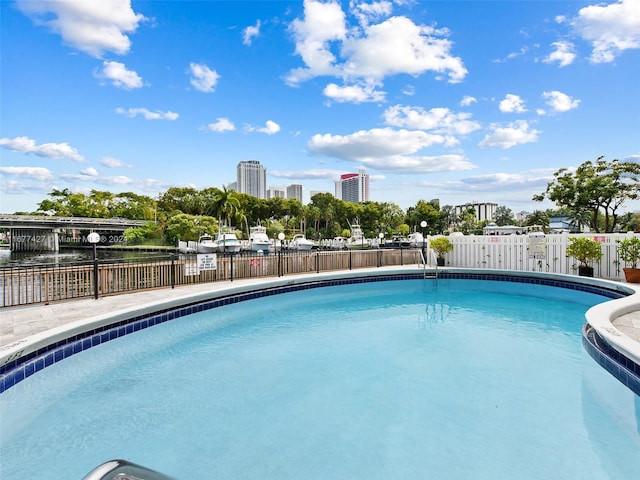 view of pool featuring a water view