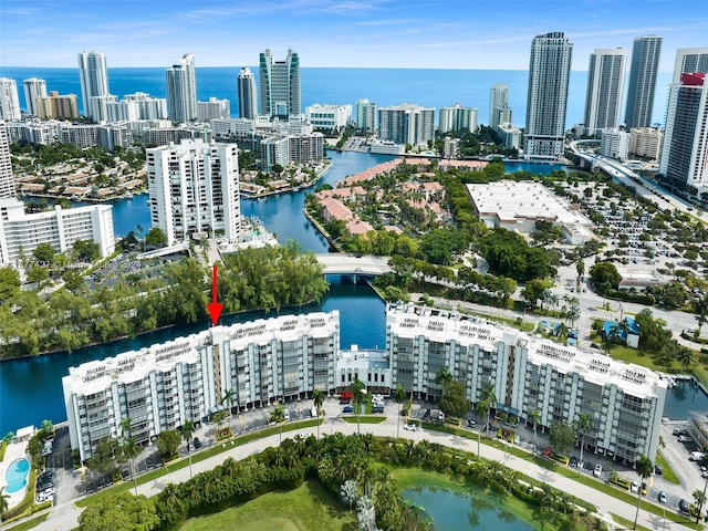 birds eye view of property with a water view