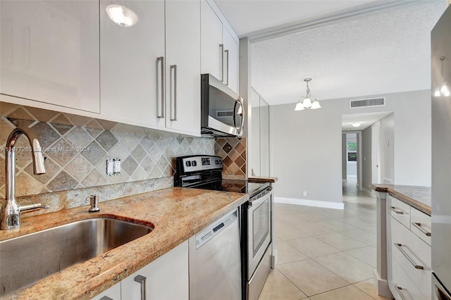 kitchen with sink, white cabinetry, and stainless steel appliances