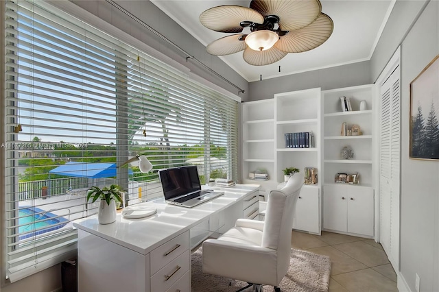 home office featuring ornamental molding, light tile patterned flooring, and ceiling fan