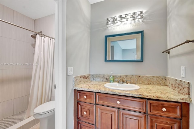 bathroom featuring vanity, toilet, and a shower with shower curtain